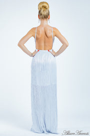 Woman wearing a white long maxi length slip dress showing it has a low back cut.