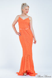 Woman wearing an orange high-low floral lace dress.