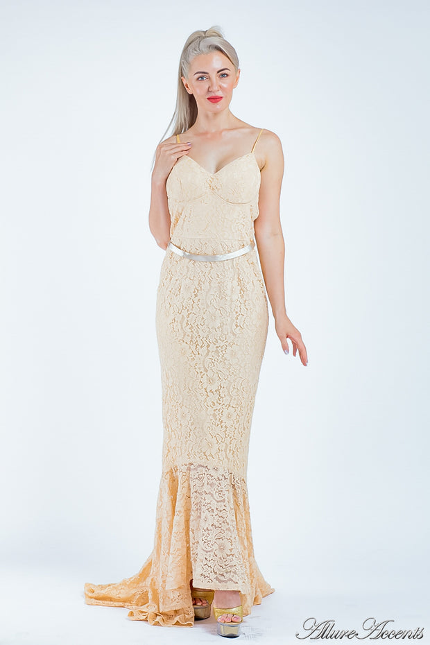 Woman wearing a champagne nude colored high-low floral lace dress.