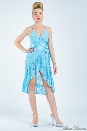 Woman wearing a turquoise lace one-size dress, summer party dress