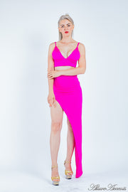 Woman wearing a hot pink 2 pieces set, summer crop top and sexy side slit long skirt