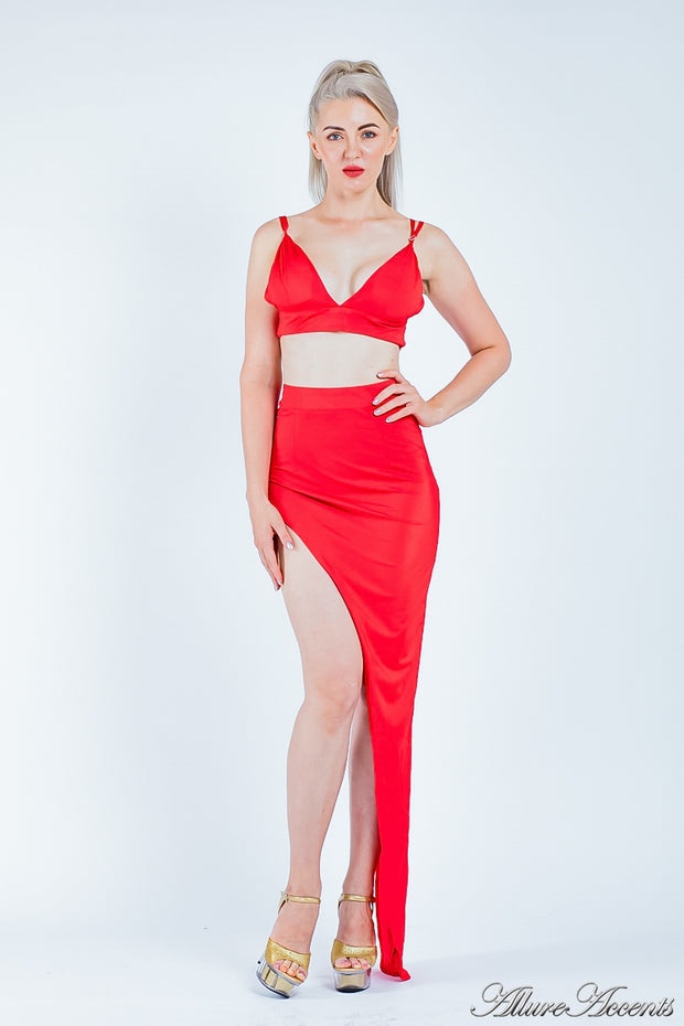 Woman wearing a red 2 pieces set, summer crop top and sexy side slit long skirt