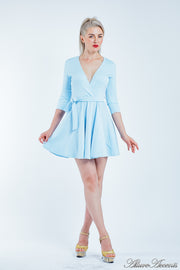 Women is wearing a baby blue mini swing dress, casual mid-sleeves all season appropriate dress