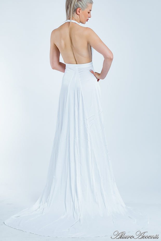 Woman showing a white silk satin halter neck gown is backless.