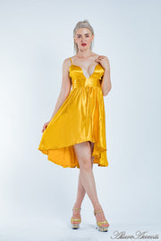 Woman wearing summer gold satin party dress, hi-low style with chest paddings