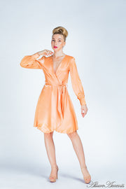 woman wearing a one-size fits all orange satin wrap dress