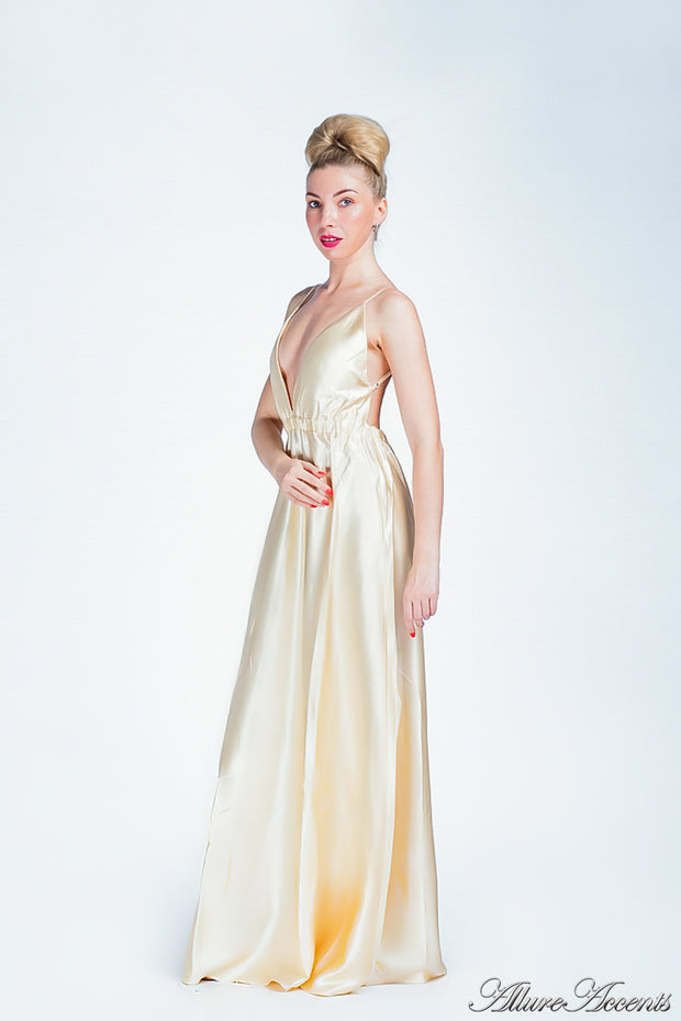 Woman wearing a carmel long satin dress.