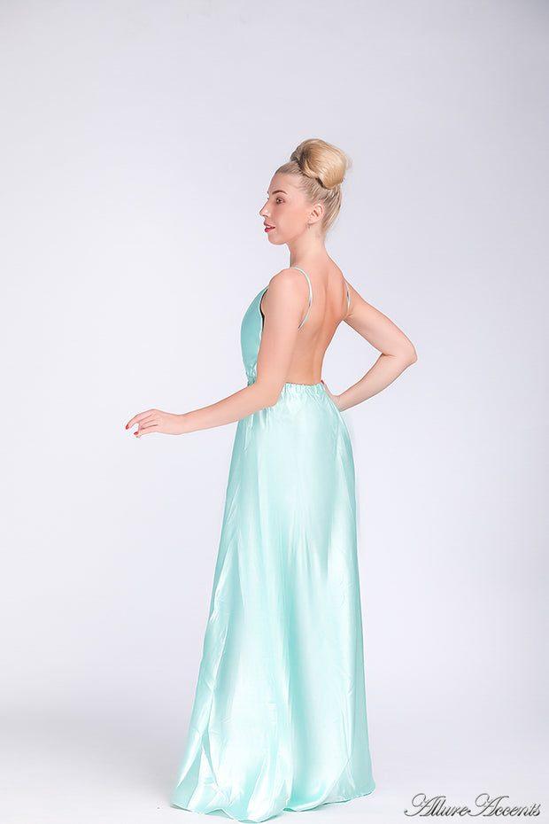 Woman wearing a tiffany blue colored long satin dress that has a deep v neckline.