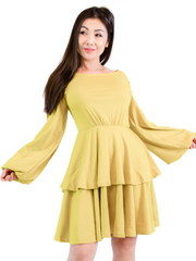 Woman is wearing a olive mini layers dress, casual long sleeves dress appropriate for all seasons 
