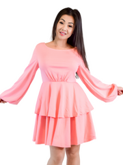 Woman is wearing a light pink mini layers dress, casual long sleeves dress appropriate for all seasons 