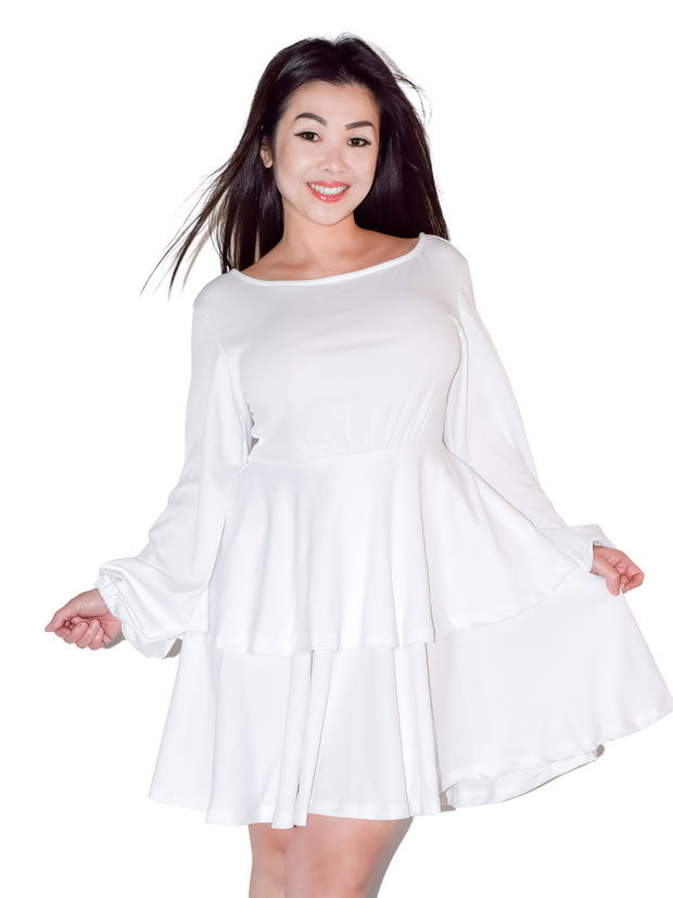 Woman is wearing a white mini layers dress, casual long sleeves dress appropriate for all seasons 