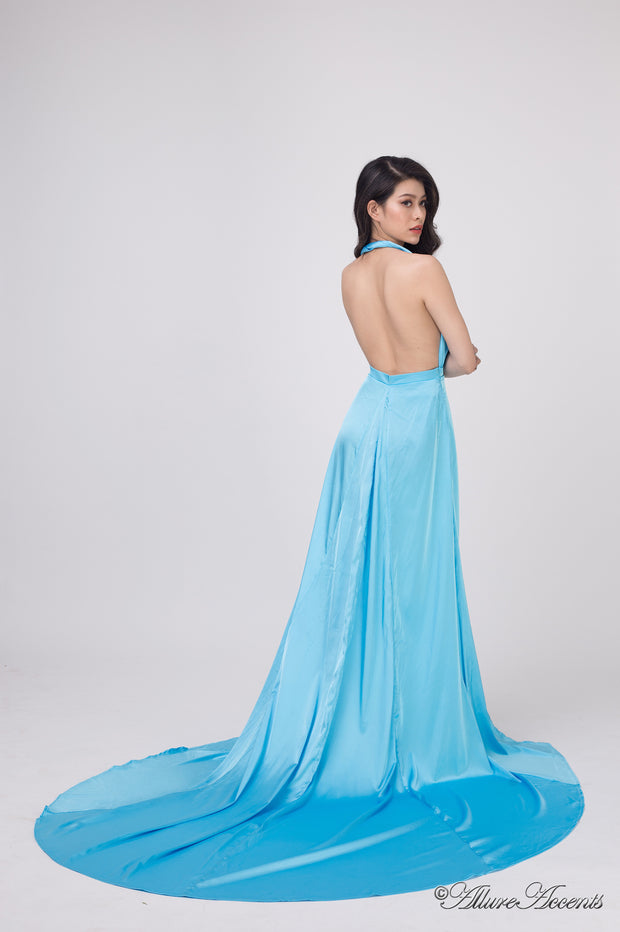 Woman showing a baby blue silk satin halter neck gown is backless.