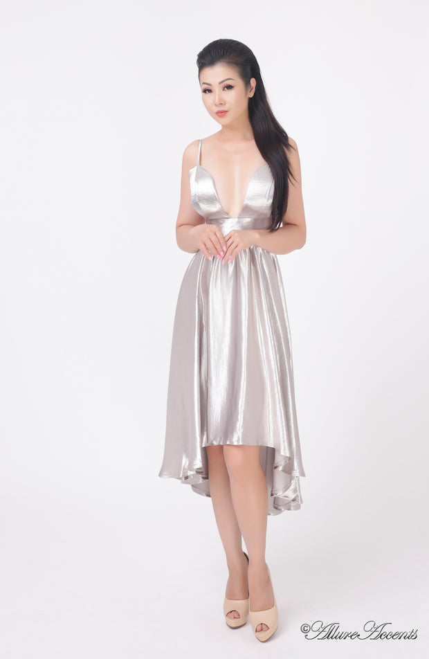 Woman wearing summer silver grey satin party dress, hi-low style with chest paddings