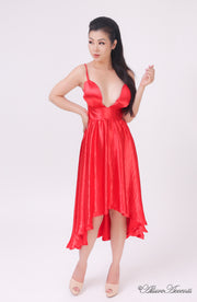 Woman wearing summer red satin party dress, hi-low style with chest paddings