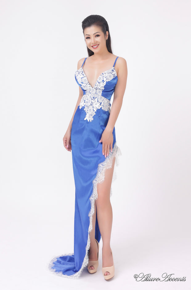 woman wearing a sexy long high slit royal blue satin dress with lace details 