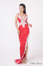 woman wearing a sexy long high slit red satin dress with lace details 
