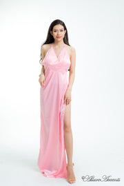 women wearing a long alter pink satin maxi dress with high slit 
