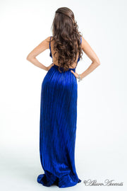 Woman wearing a royal blue long maxi length slip dress showing it has a low back cut.