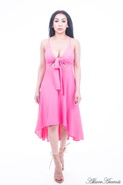 Woman is wearing a hot pink hi-low dress, sexy summer sleeveless casual dress with front adjustable tie bow