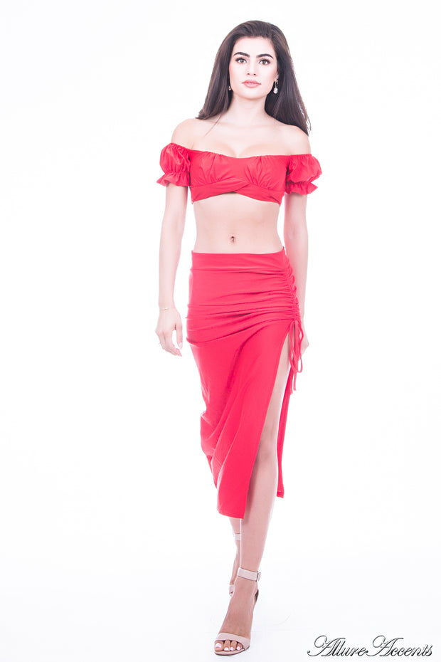 Woman is wearing a red 2 pieces summer party set, ruffle top and ruche tie skirt 