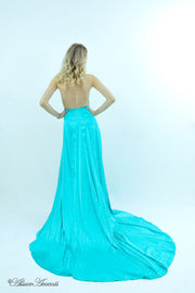 Woman showing a tiffany blue silk satin halter neck gown is backless.