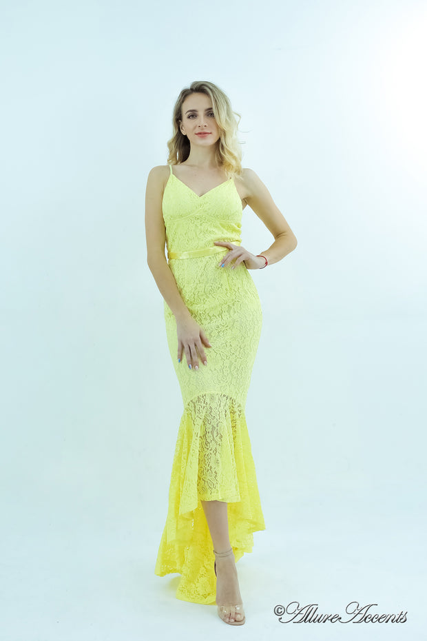 Woman wearing a yellow high-low floral lace dress.