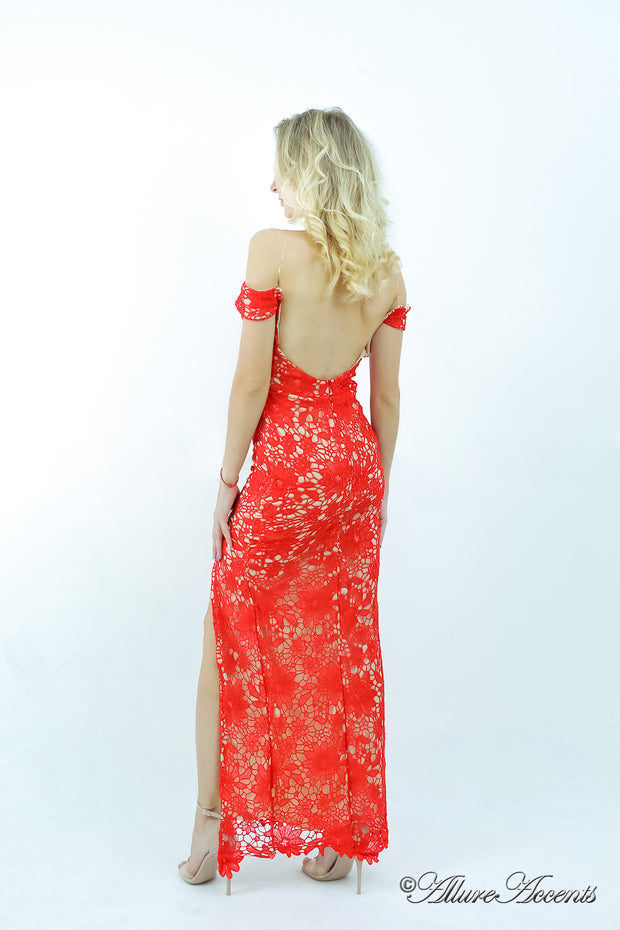 Woman wearing an off-the-shoulder red lace dress.