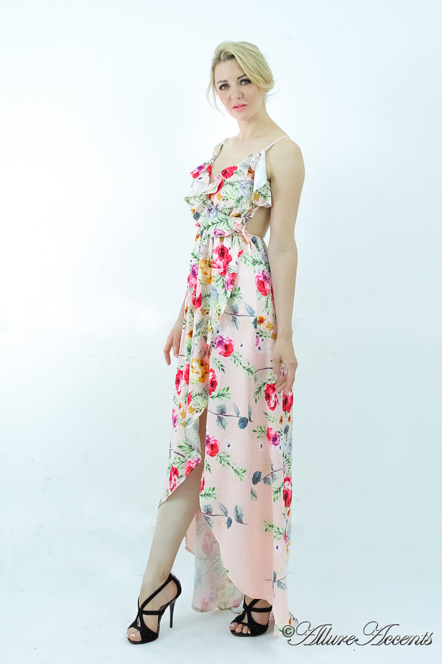 Women is wearing a blush multi color floral maxi dress, sexy satin floral sundress with low-cut back with ruffles detail 