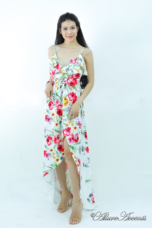 Women is wearing a white multi color floral maxi dress, sexy satin floral sundress with low-cut back with ruffles detail 