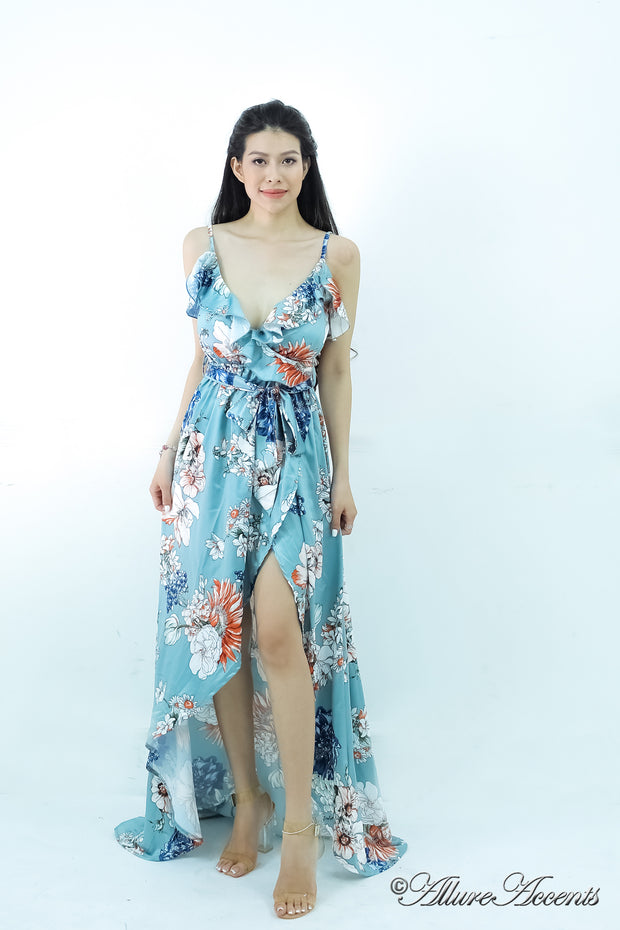 Women is wearing a blue multi color floral maxi dress, sexy satin floral sundress with low-cut back with ruffles detail 