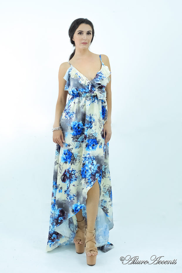 Women is wearing a blue multi color floral maxi dress, sexy satin floral sundress with low-cut back with ruffles detail 