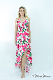 Women is wearing a pink multi color floral maxi dress, sexy satin floral sundress with low-cut back with ruffles detail 