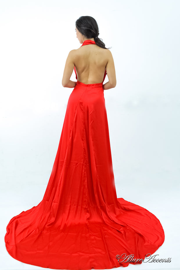 Woman showing a red silk satin halter neck gown is backless.