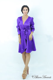 woman wearing a one-size fits all purple satin wrap dress