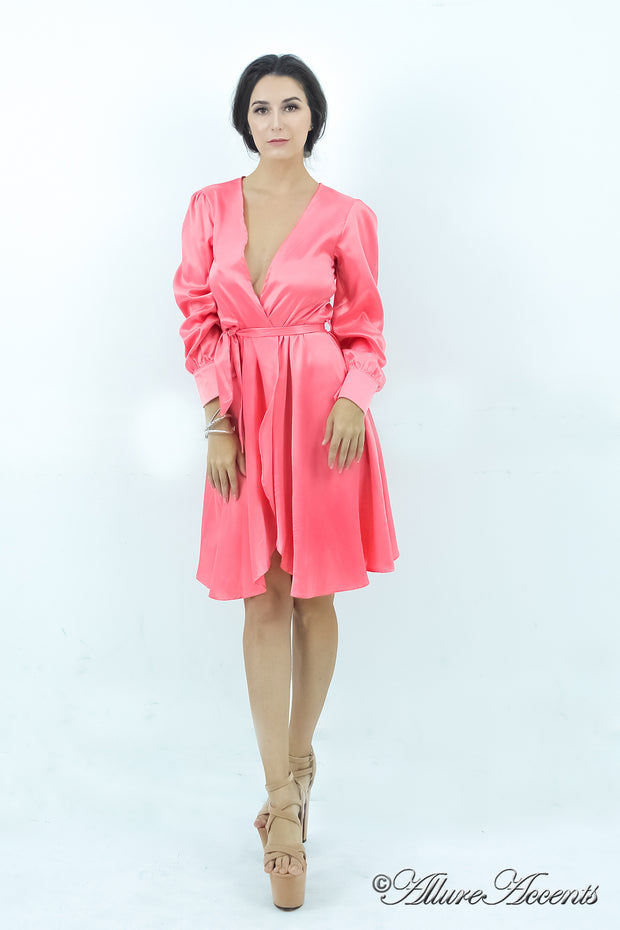 woman wearing a one-size fits all coral satin wrap dress