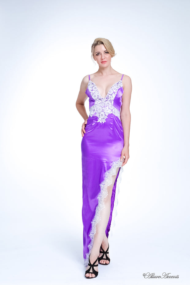 woman wearing a sexy long high slit purple satin dress with lace details 