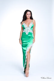 woman wearing a sexy long high slit gold green dress with lace details 