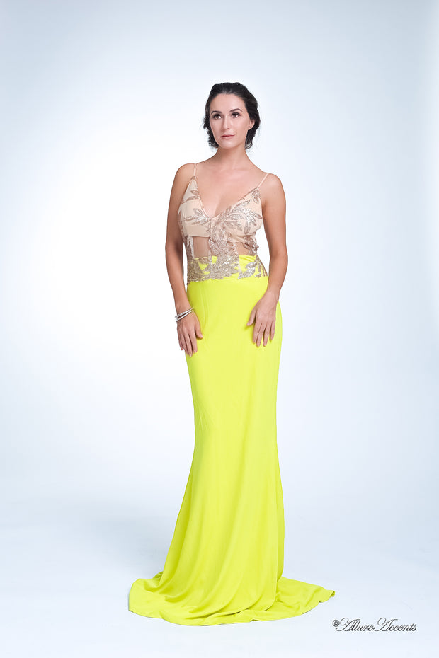 Woman wearing a long lemon yellow colored sequined gown