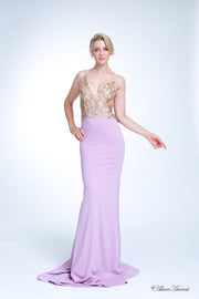 Woman wearing a long lavender colored sequined gown 