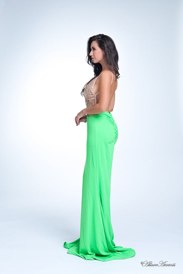 Woman wearing a sequined long lime green colored gown.