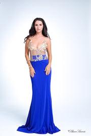 Woman wearing a long royal blue colored sequined gown
