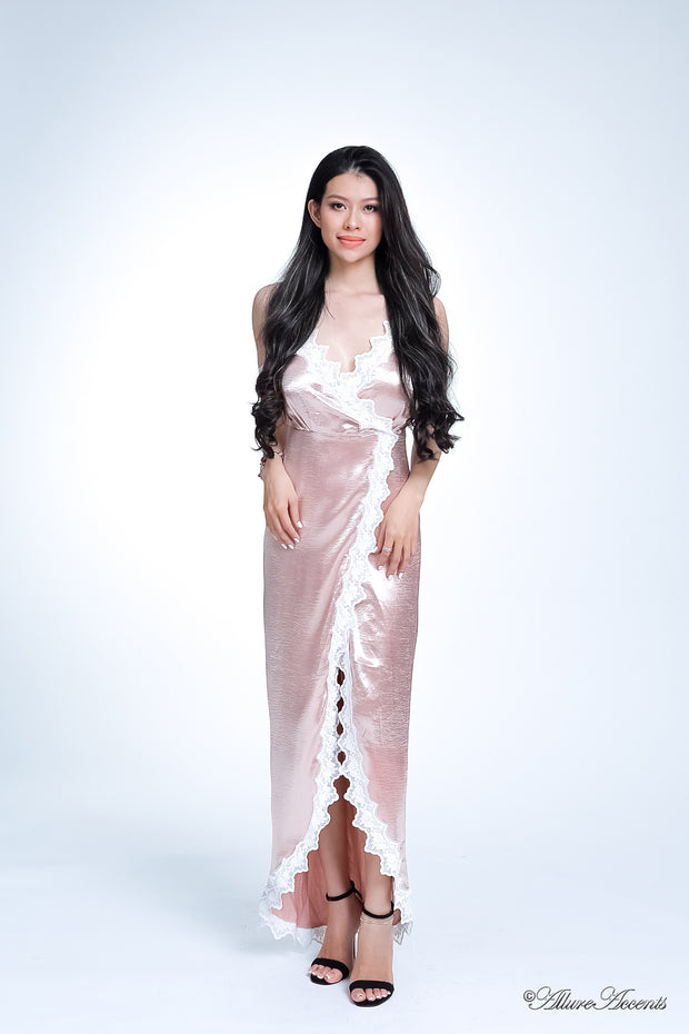 Woman wearing a champagne satin midi dress, low-cut back with lace details