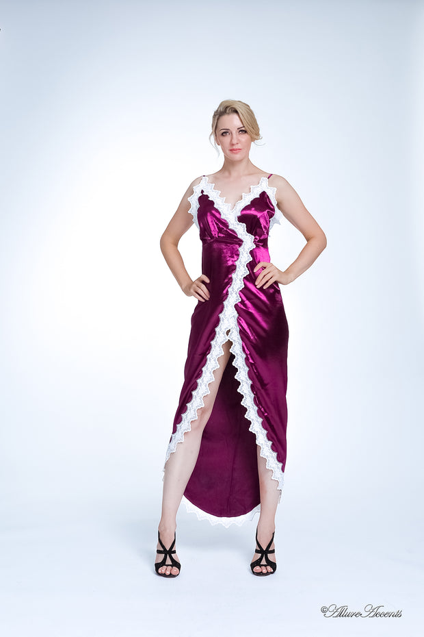 Woman wearing a burgundy satin midi dress, low-cut back with lace details