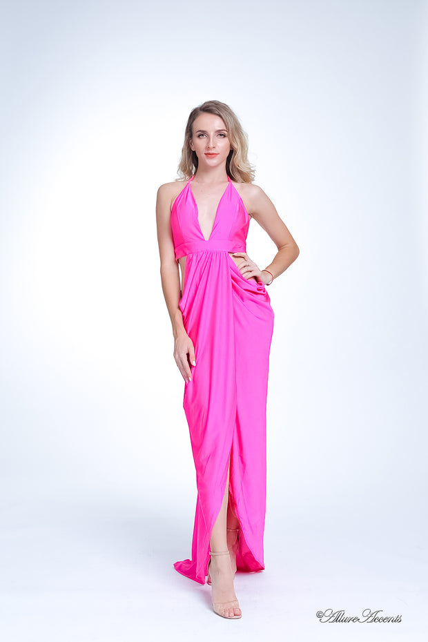 A woman wearing a sexy hot pink party long maxi dress