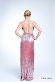 Woman wearing a cherry red long maxi length slip dress showing it has a low back cut.