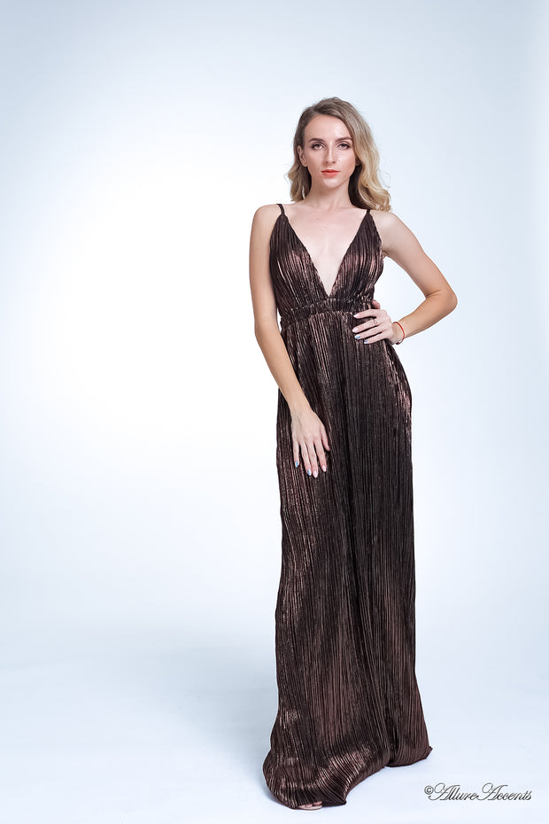 Woman wearing a dark brown, coffee colored maxi length slip dress with a deep v neck.