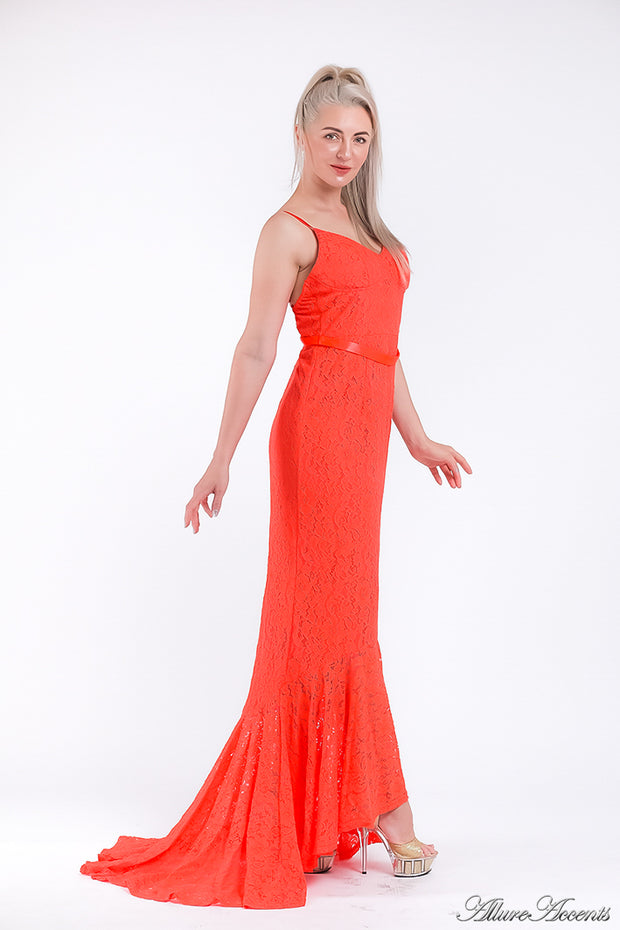 Woman wearing an orange high-low floral lace dress.