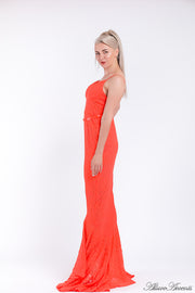 Woman wearing an orange high-low floral lace dress.