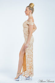 Woman wearing a champagne nude color off-the-shoulder lace dress.