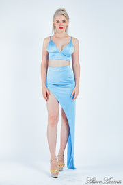 Woman wearing a light blue 2 pieces set, summer crop top and sexy side slit long skirt